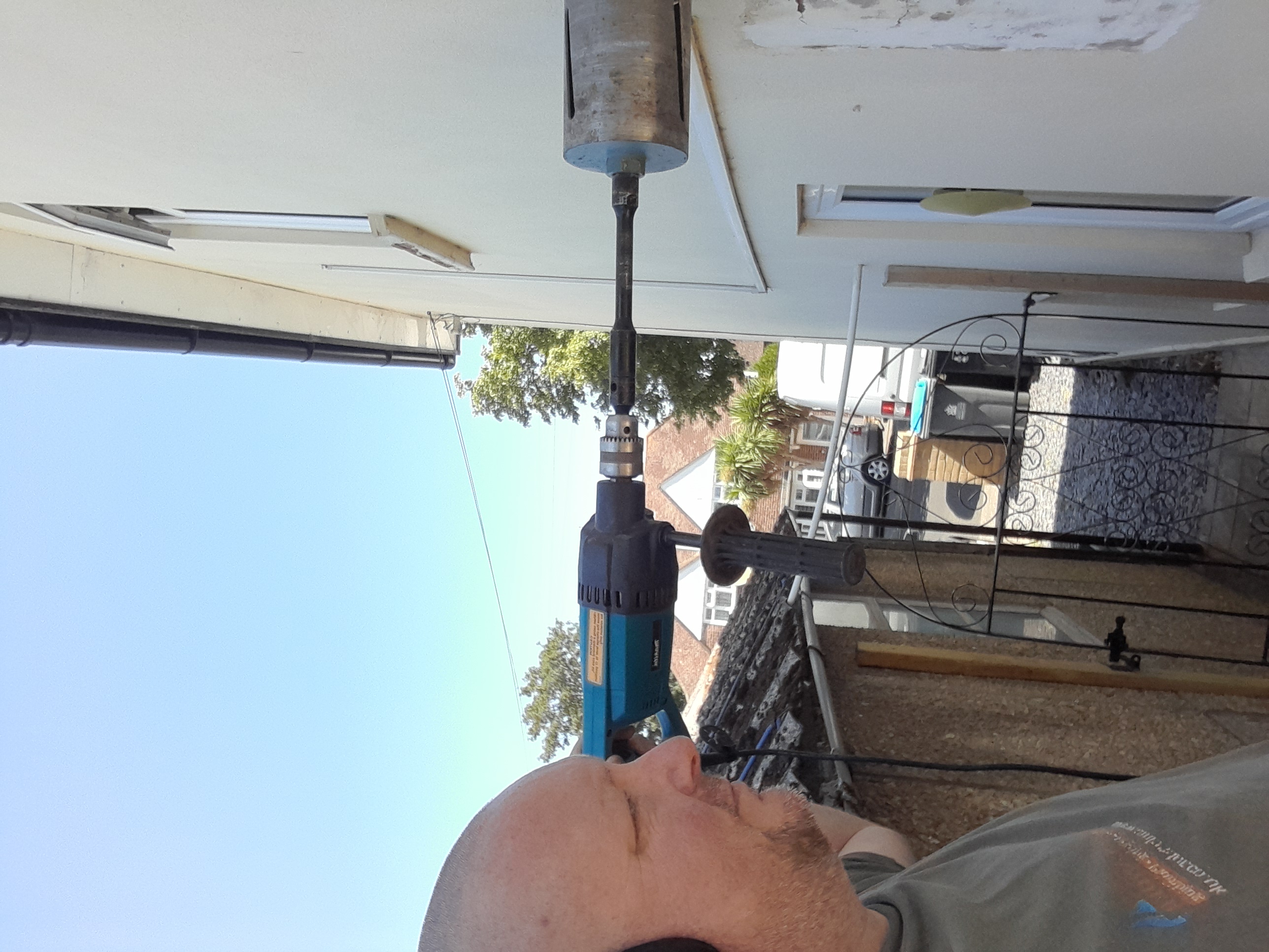 Andy Lander core drilling for a flue on-site