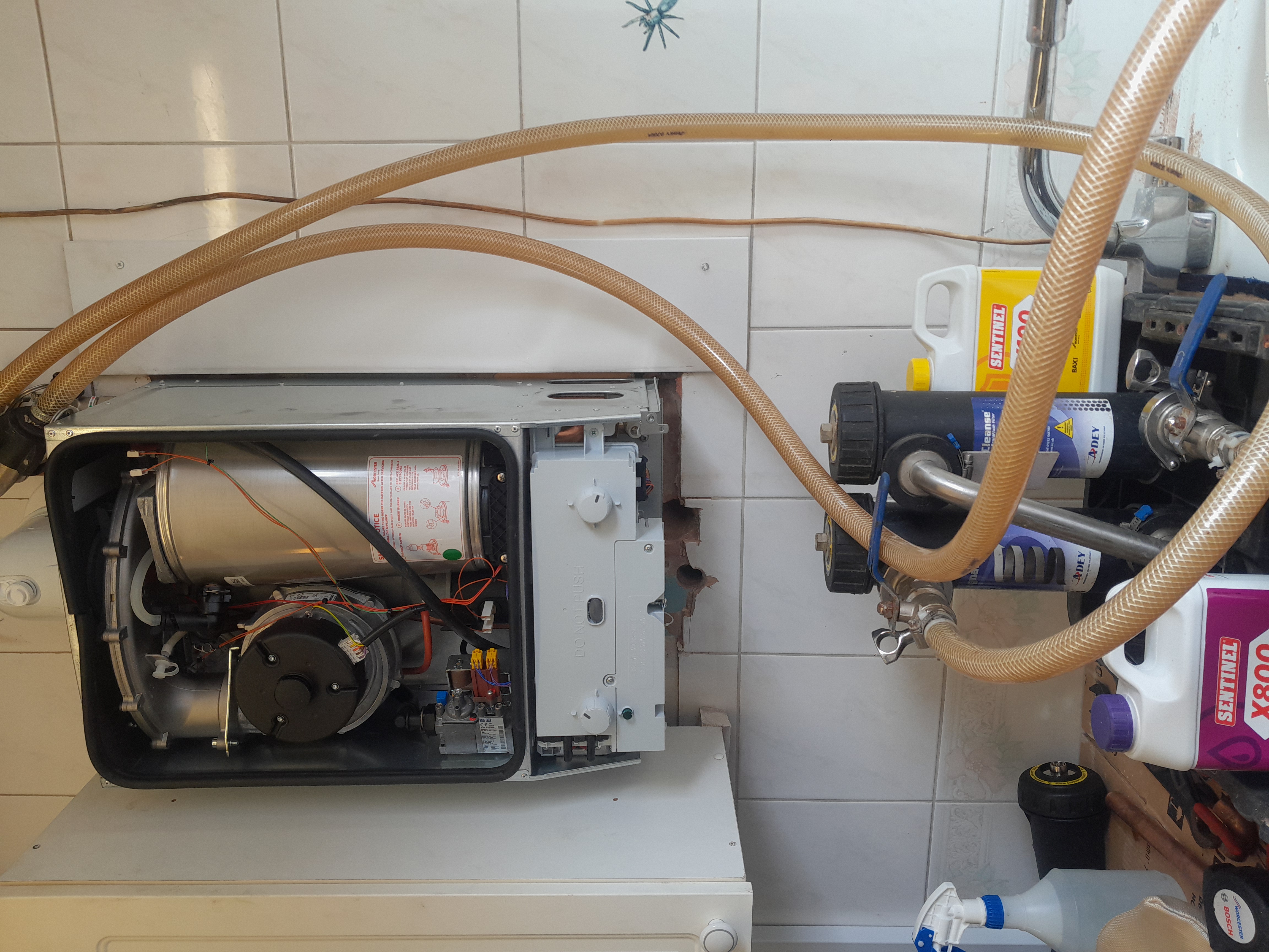 Boiler internals being inspected during a repair call-out in Esher