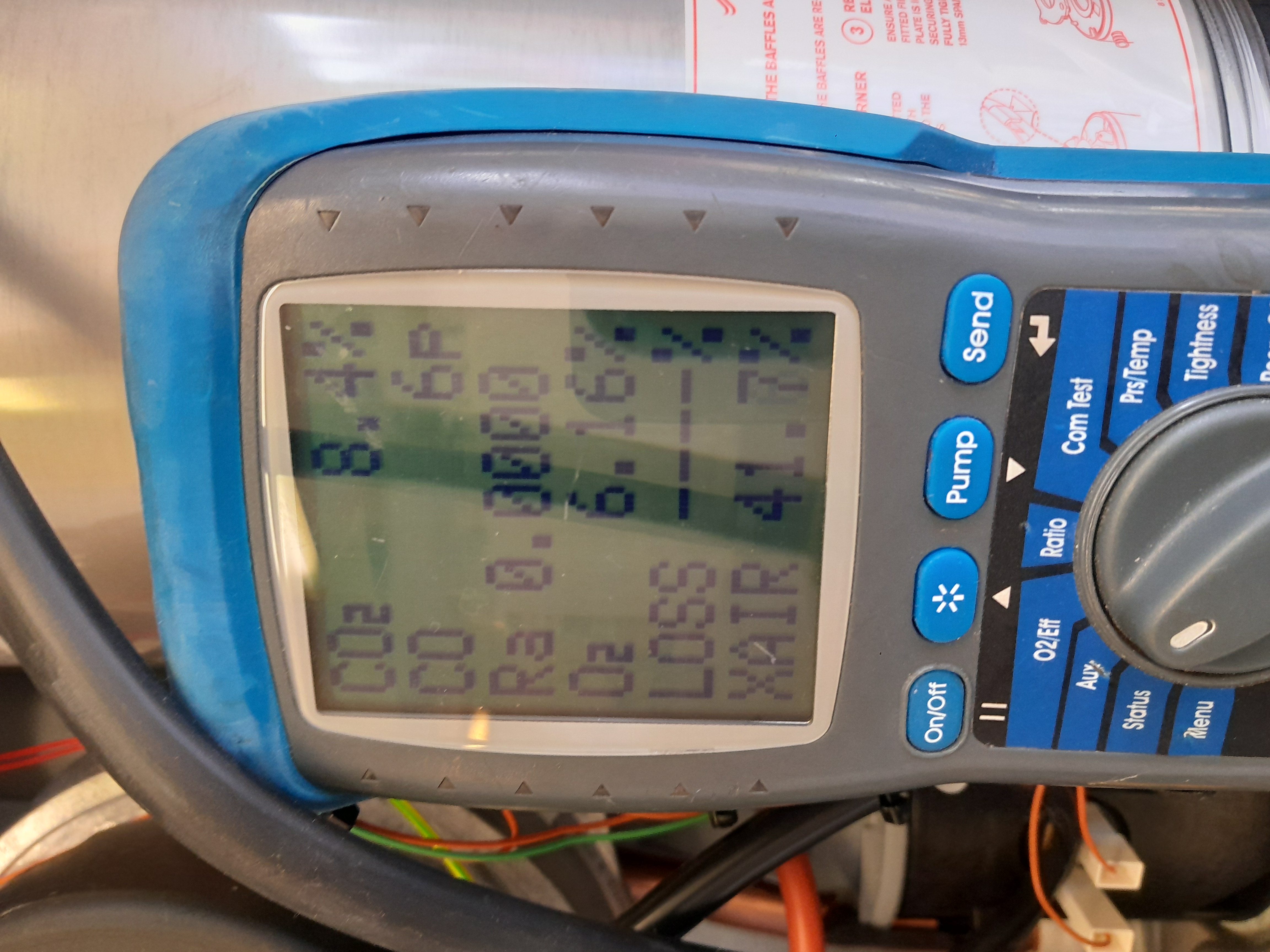 Flue gas analyzer readout showing combustion results during a gas safety check