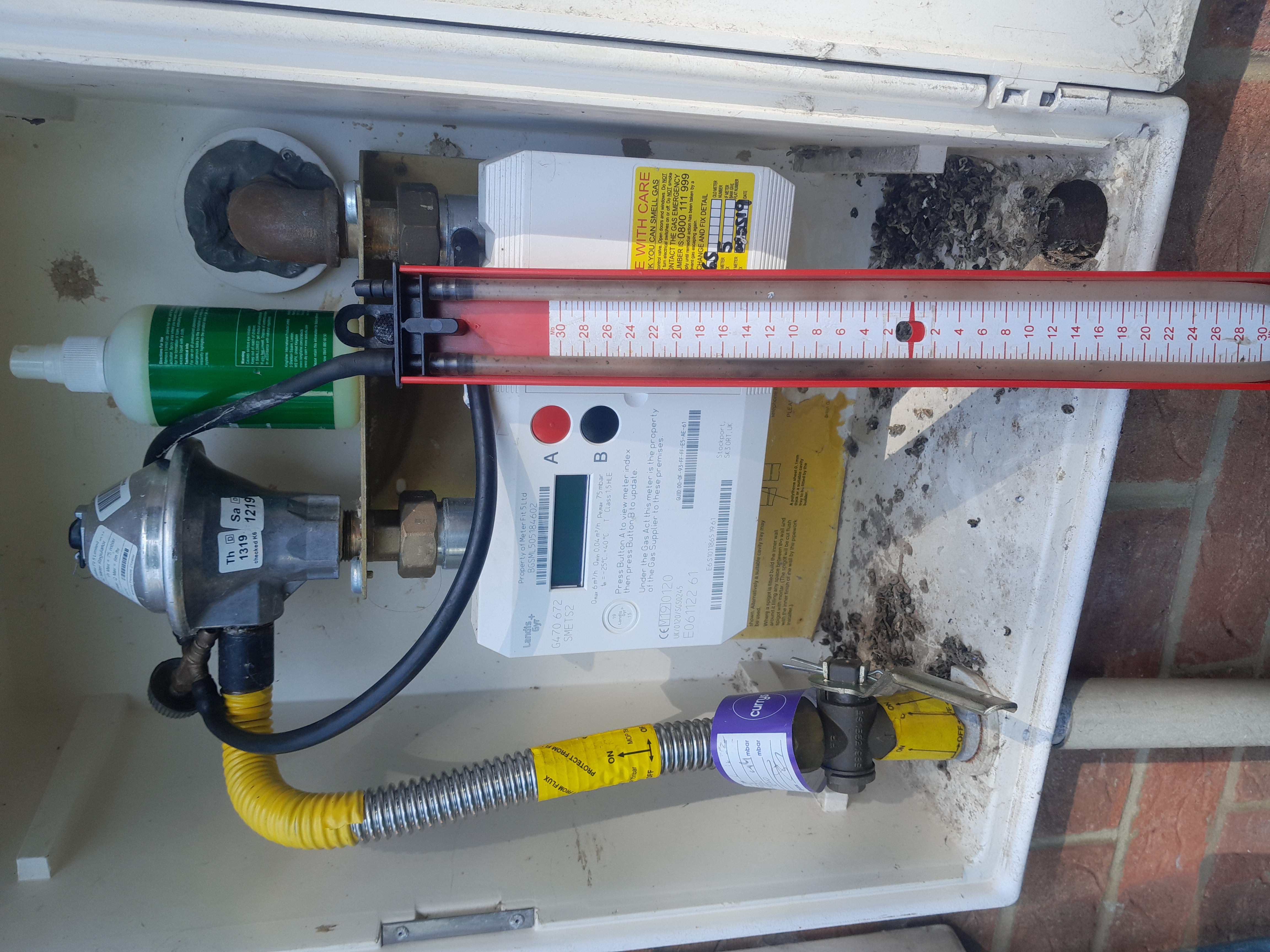 Gas meter being checked as part of a CP12 gas safety inspection