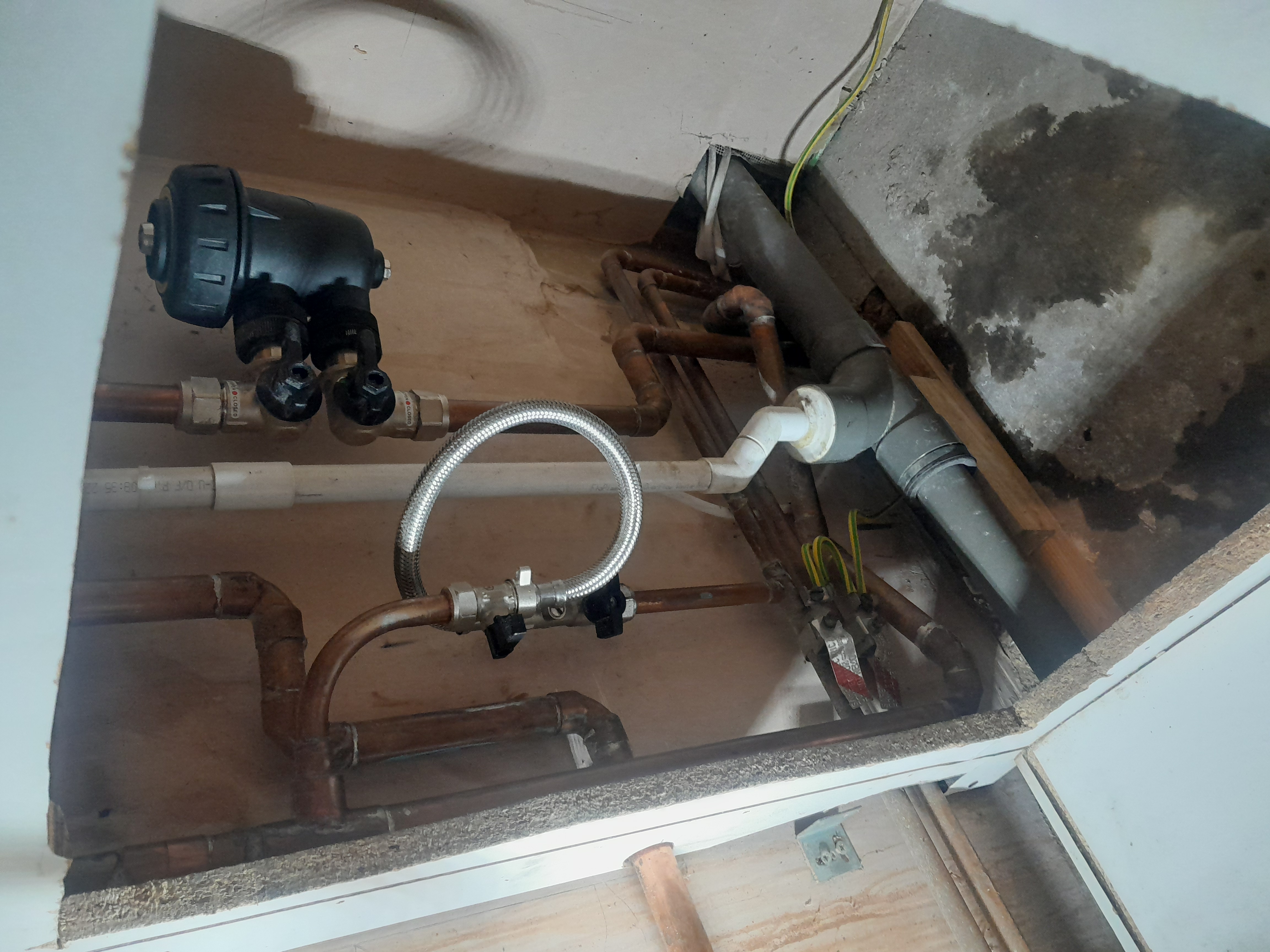 Completed pump installation with new flexible hose connections