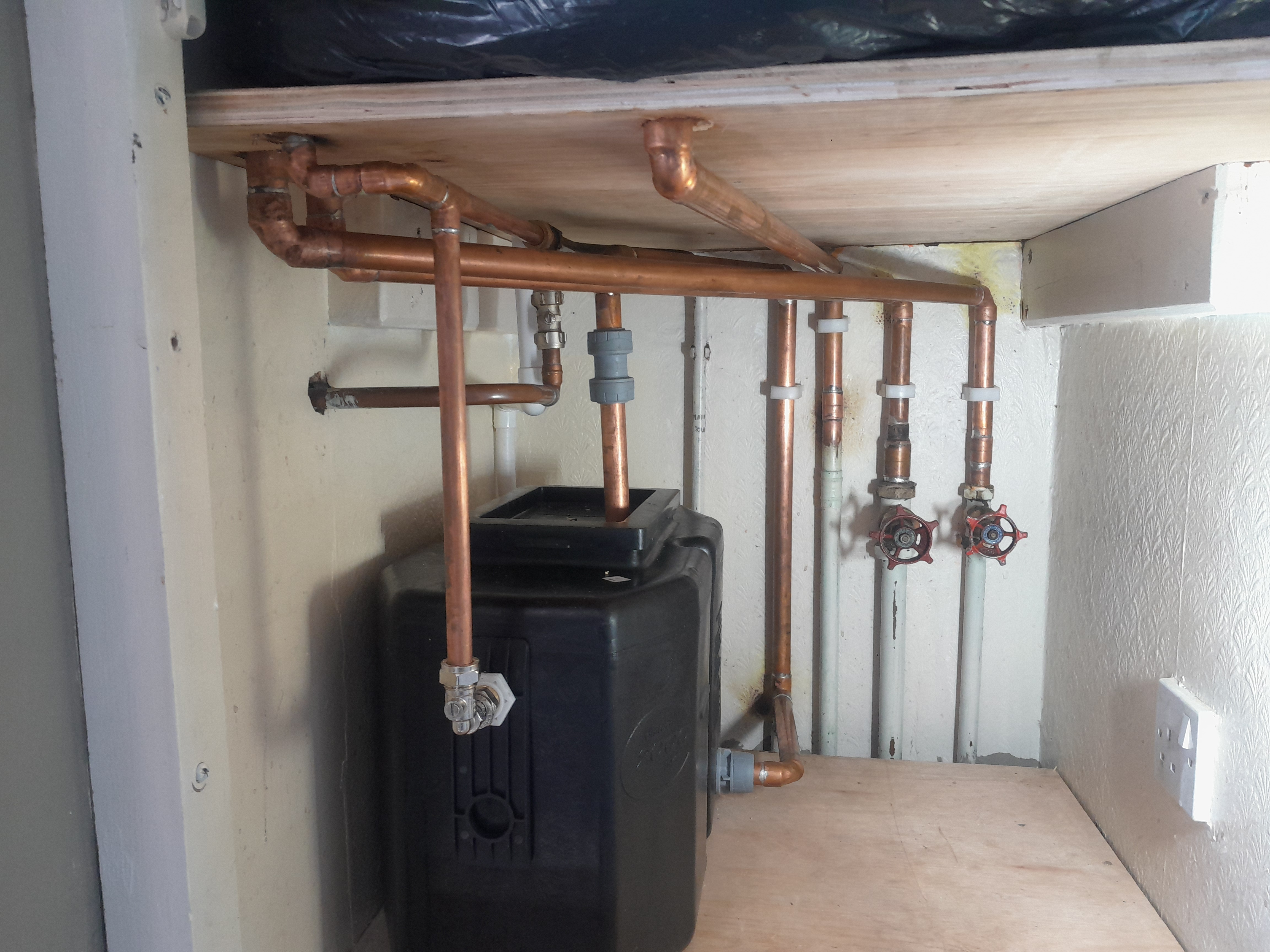 Copper pipework and isolation valves above an unvented cylinder